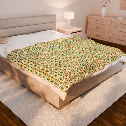 Bed with a patterned blanket in a bedroom setting