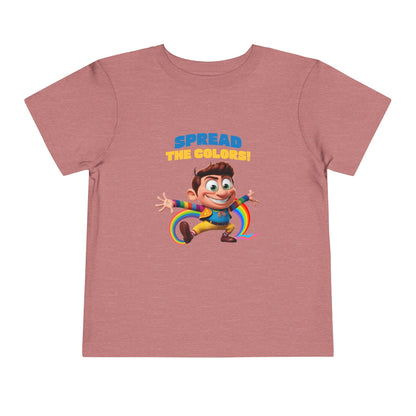 Cartoon boy jumping with rainbow trail and "Spread the Colors!" text on heather mauve T-shirt.


