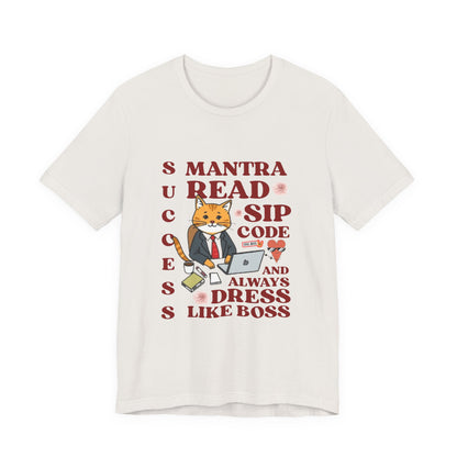 White t-shirt with a graphic of a cat in a suit and text on a white background