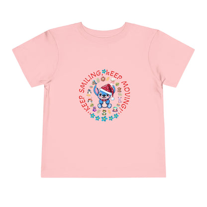 Toddler t-shirt with a cute dog illustration and motivational quote "Keep Smiling Keep Moving" printed in the center.