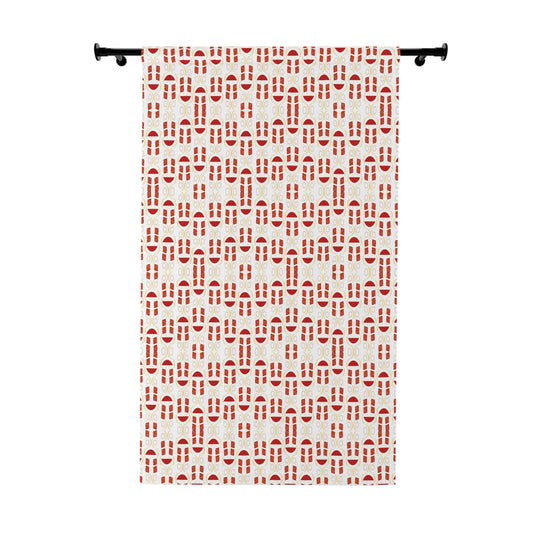 Red and white geometric pattern curtain hanging on window in a modern room


