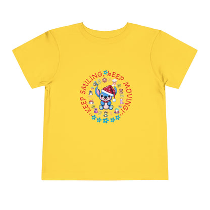 Toddler t-shirt with a cute dog illustration and motivational quote "Keep Smiling Keep Moving" printed in the center.