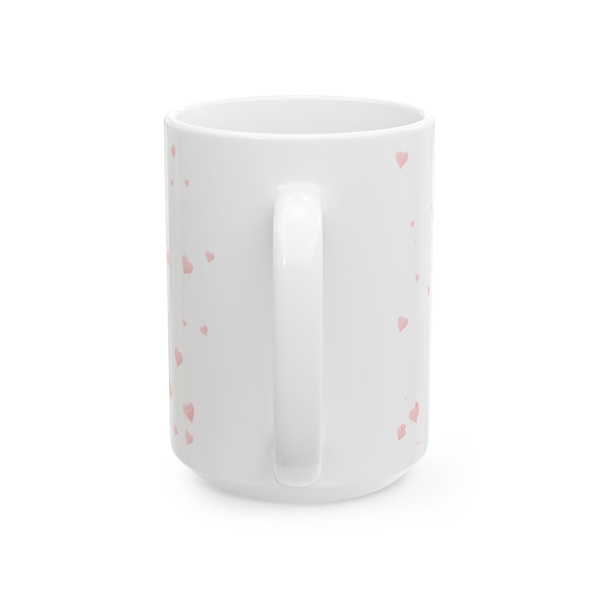White mug with pink heart patterns on a white background