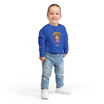 Child wearing a blue sweatshirt with a cartoon character on a white backgroun