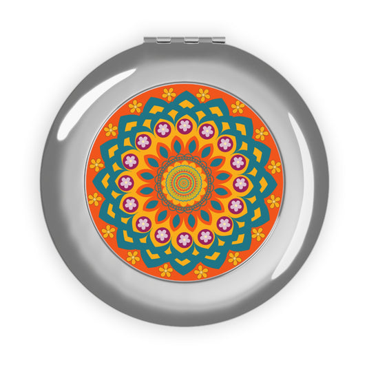 Compact travel mirror with a colorful mandala design on the cover, featuring a floral pattern in vibrant colors.