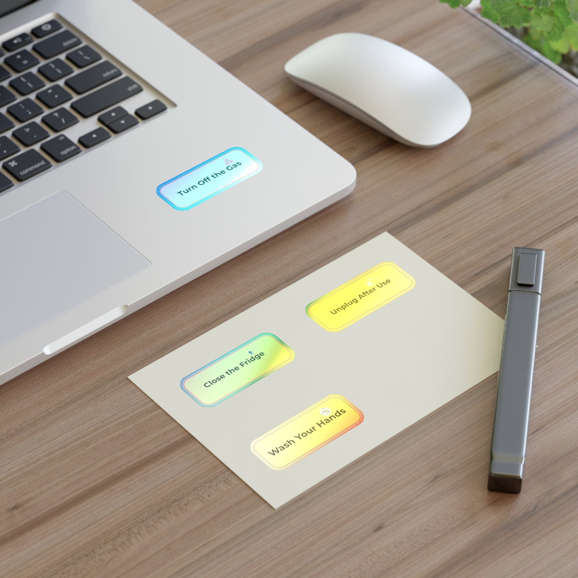 Laptop on a desk with a sheet of paper displaying hygiene reminders and a JUUL device.