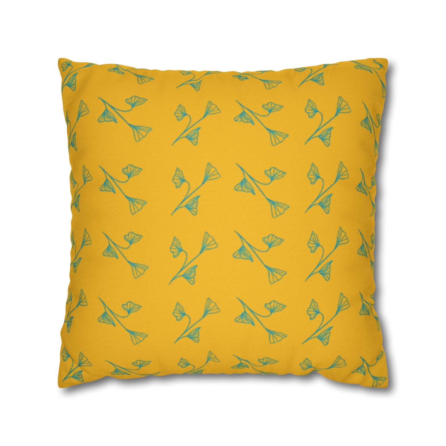 A square-shaped yellow pillowcase with a green leaf pattern.