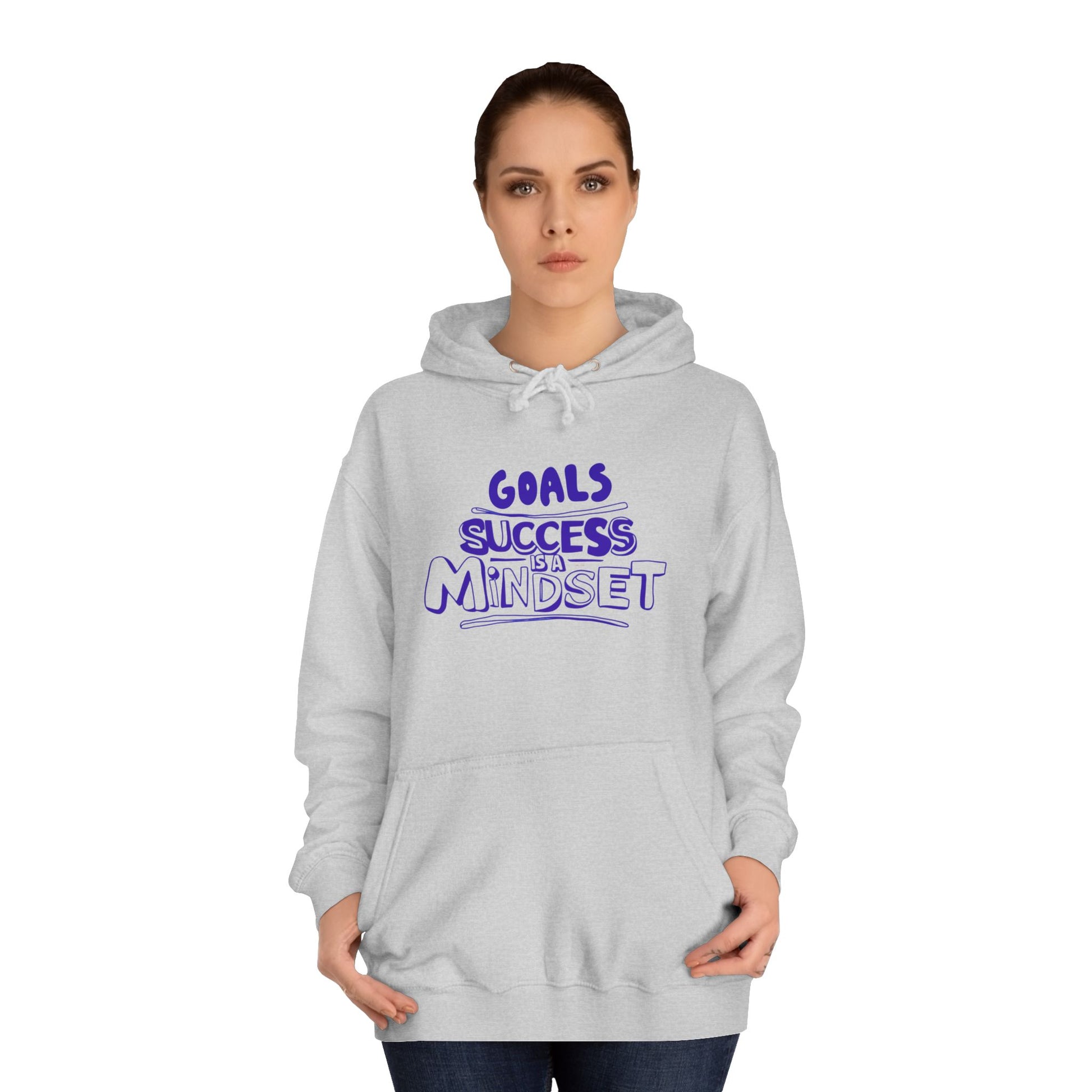 Person wearing a gray hoodie with a motivational quote on a white background