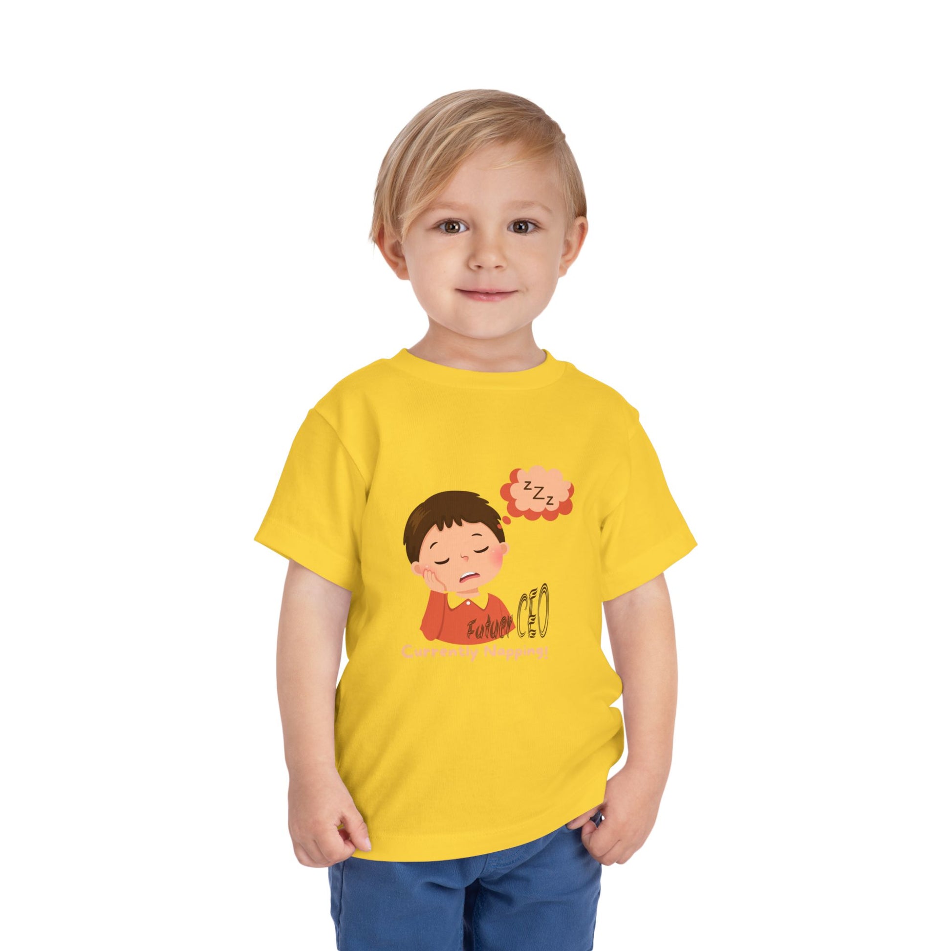 Child wearing a yellow t-shirt with a cartoon character on a white background