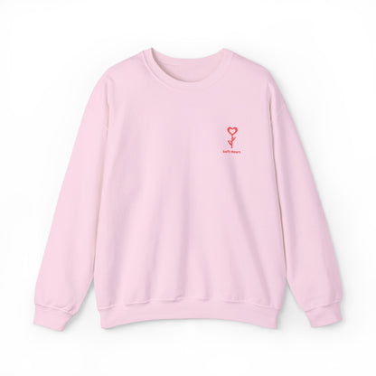 Pink sweatshirt with a small red logo on a white background