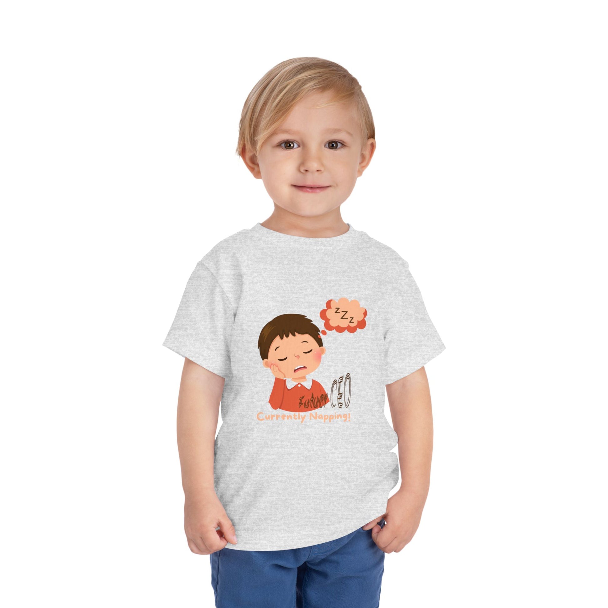 Child wearing a gray t-shirt with a cartoon character and text on a white background
