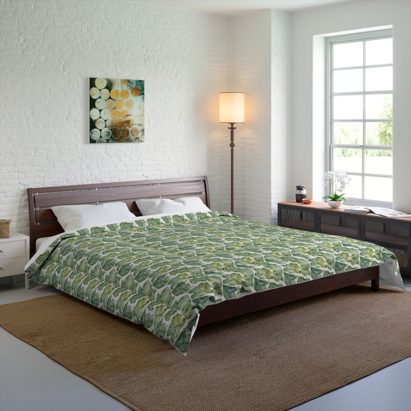Bedroom with a green patterned comforter on a bed.