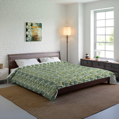 Bedroom with a green patterned comforter on a bed.