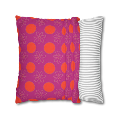  pillow with patterned covers, one pink with red circles and flowers, the other white with gray stripes, on a white background.