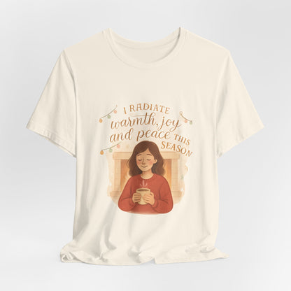 White t-shirt with a graphic of a person holding a mug and text on a light gray background