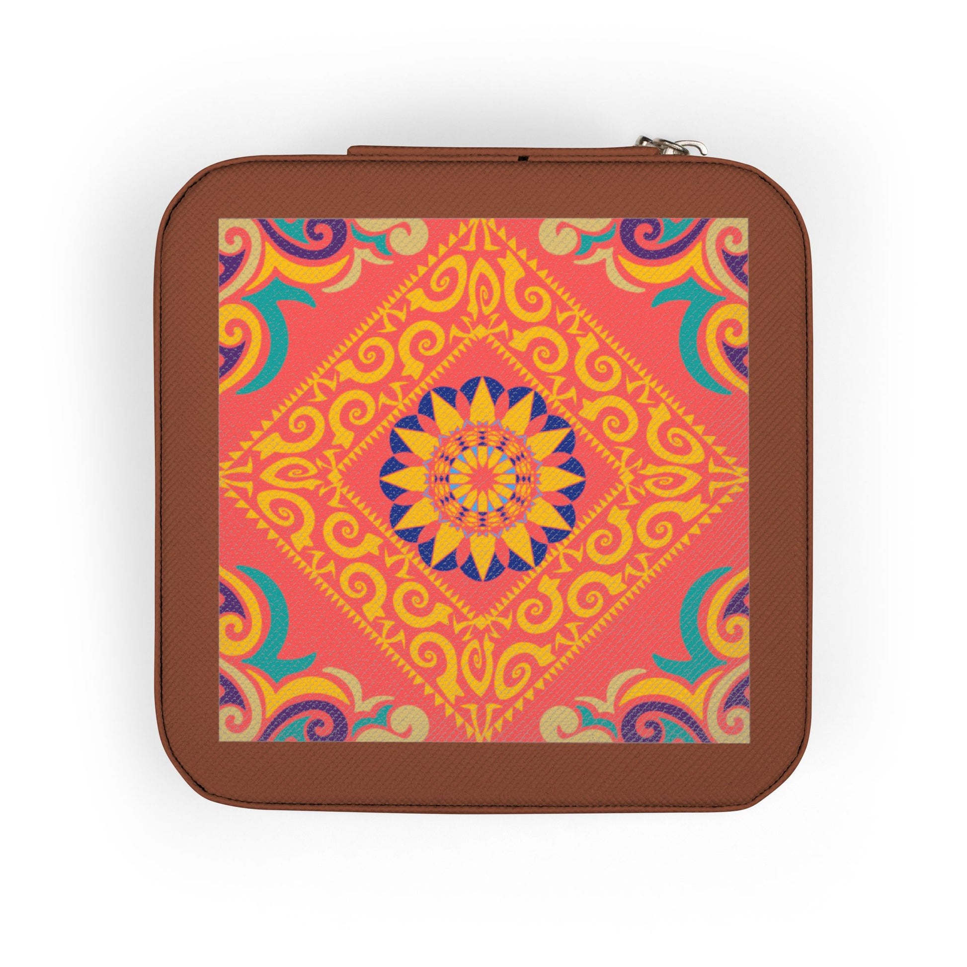 Hand holding a small square travel jewelry case with a colorful pattern on a white background