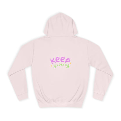 Pink hoodie with 'Keep Going' text on a white background