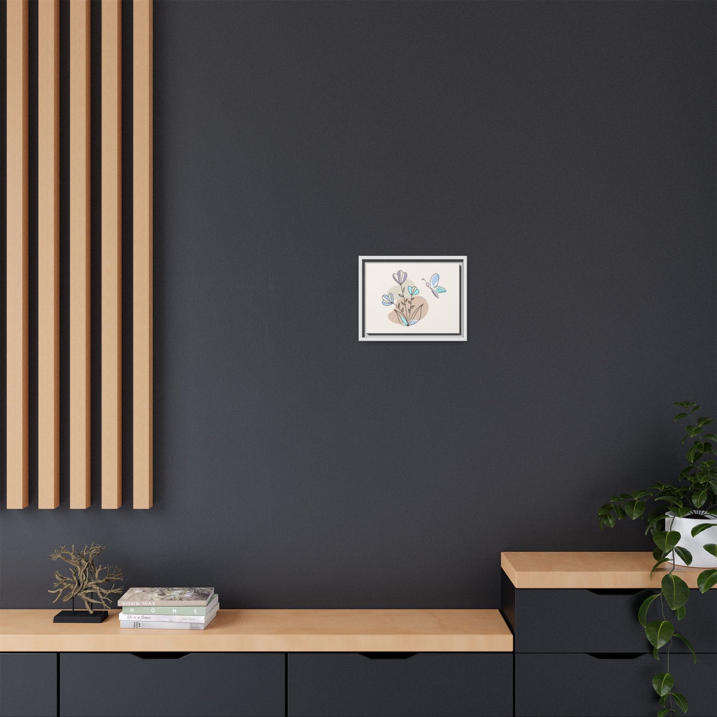 Framed artwork on a dark wall with wooden shelves and decor items.