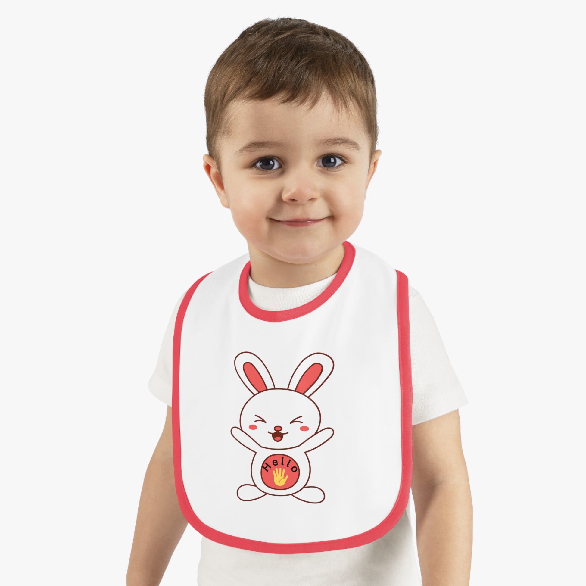 Child wearing a white t-shirt with a cartoon rabbit design on a bib.

