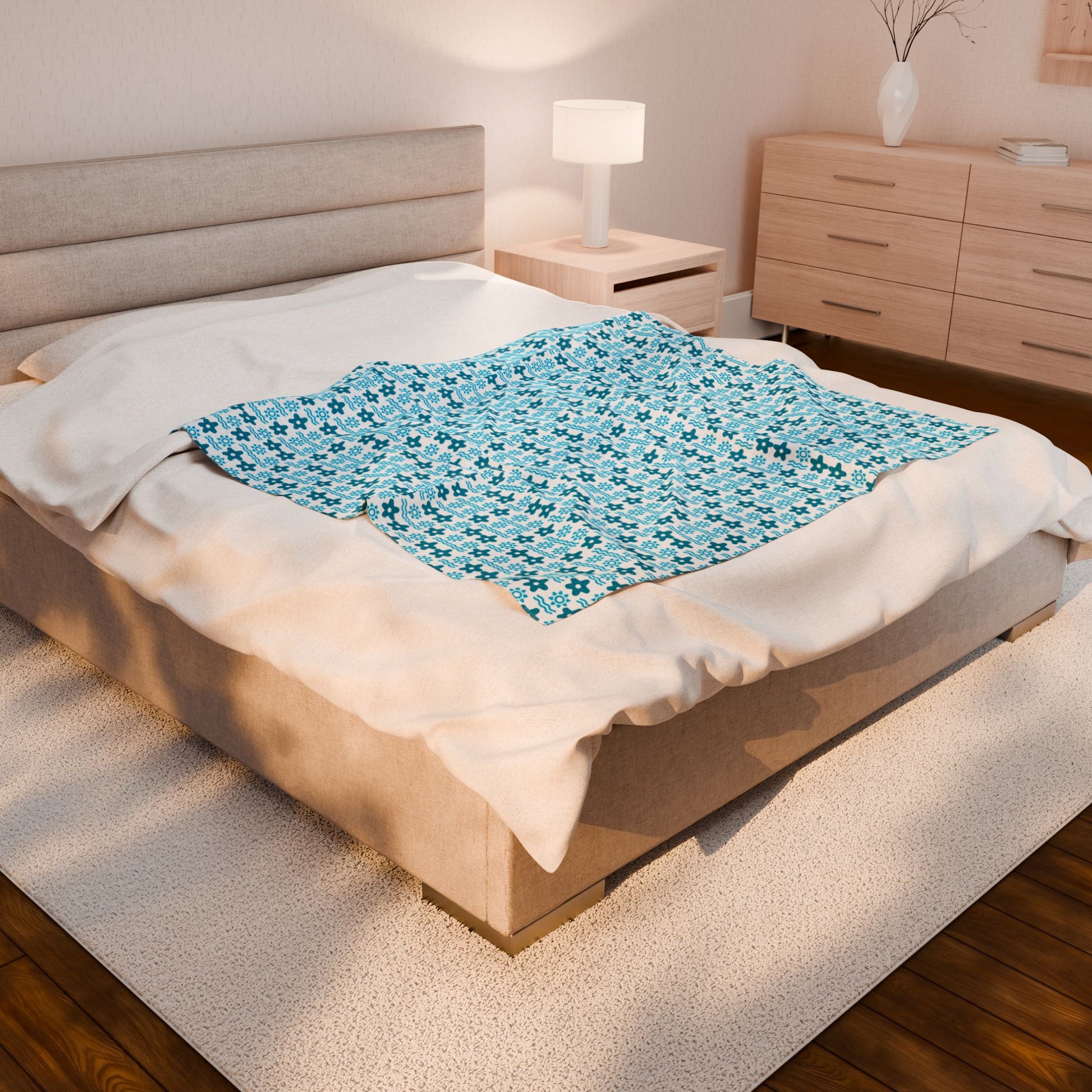 Bed with a blue gel pad on the mattress in a bedroom.