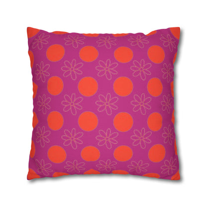 Decorative pillow with pink and orange pattern on a white background