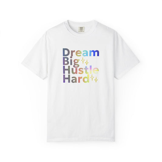 White t-shirt with colorful text 'Dream Big Hustle Hard' on a white background
