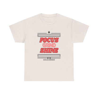A ice gray unisex heavy cotton tee with the text 'FOCUS GRIND SHINE' printed on the front.