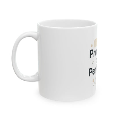 White mug with text and a small graphic on a white background