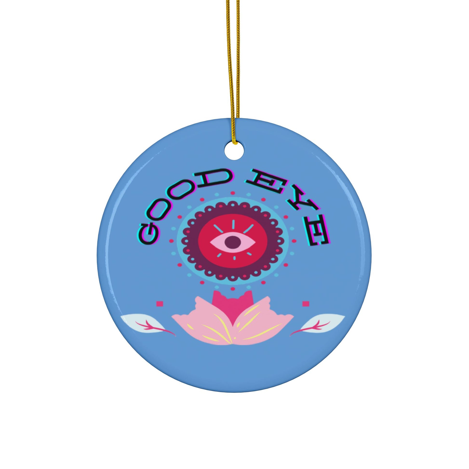 A blue ceramic ornament with a colorful floral design and the text 'GOOD EYE' at the top.