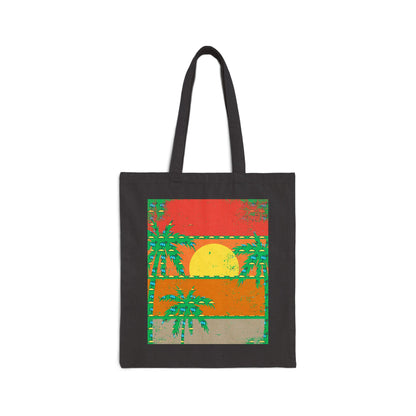 Black tote bag with a tropical sunset design on a white background