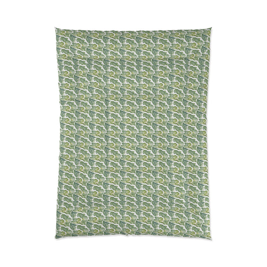 A comforter with a geometric pattern in shades of green and white, displayed against a white background.