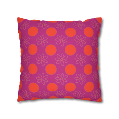 Decorative pillow with pink and orange pattern on a white background
