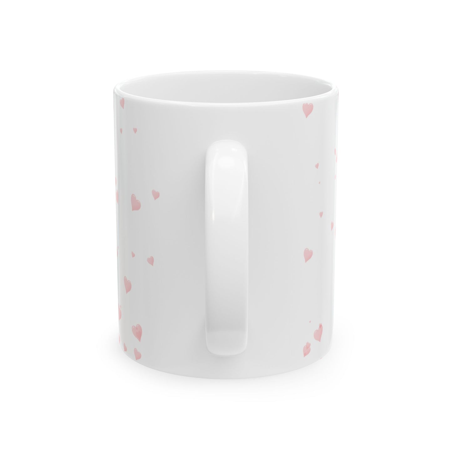 White mug with pink heart patterns on a white background