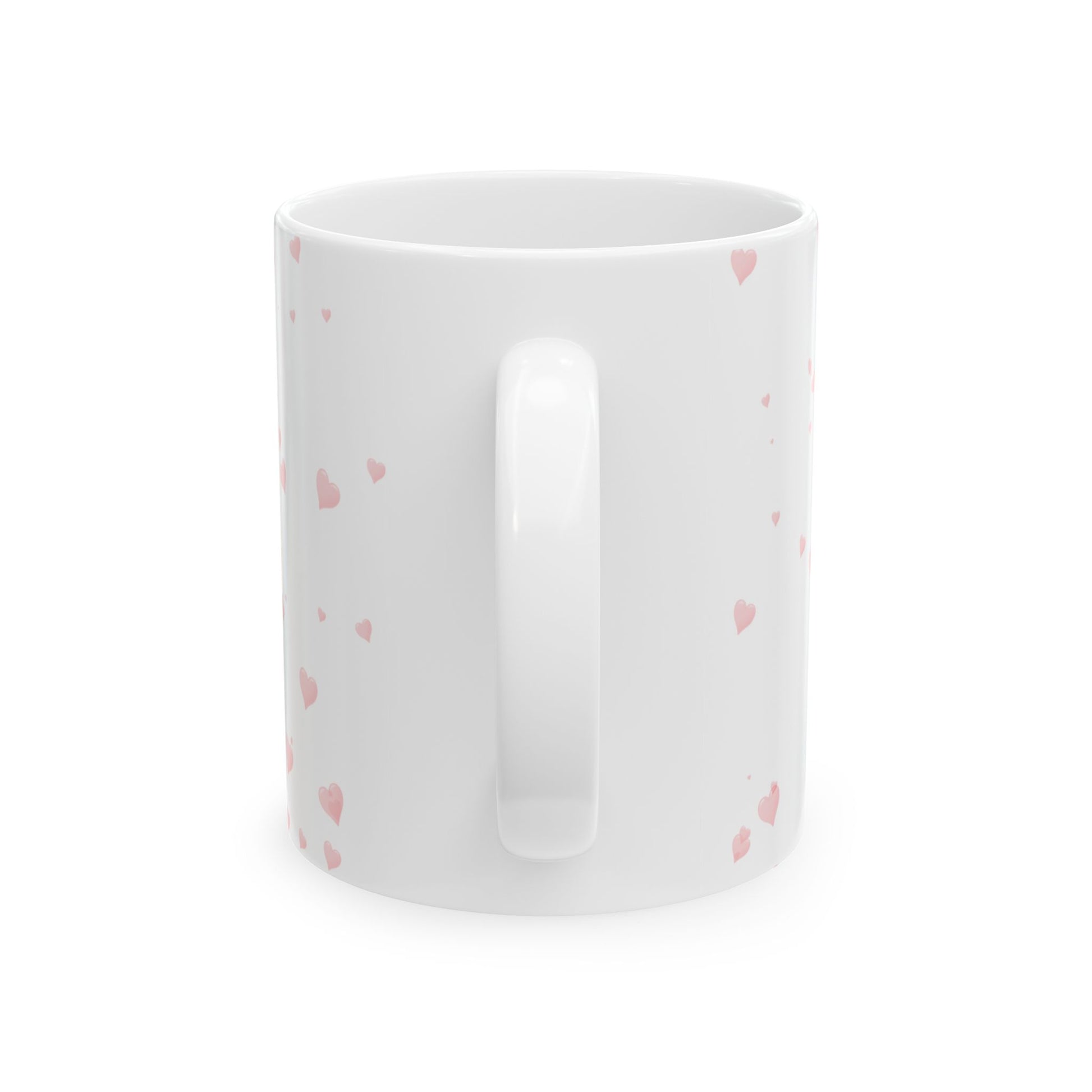 White mug with pink heart patterns on a white background