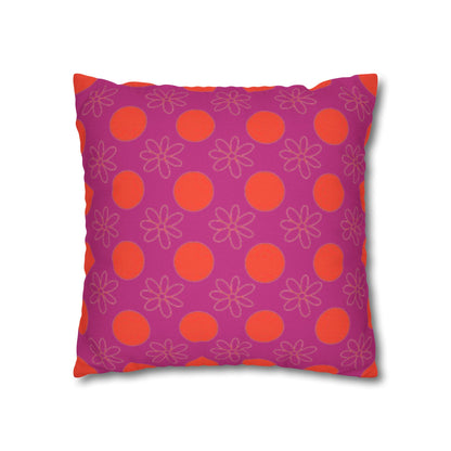 Decorative pillow with purple background and red circle and floral pattern.