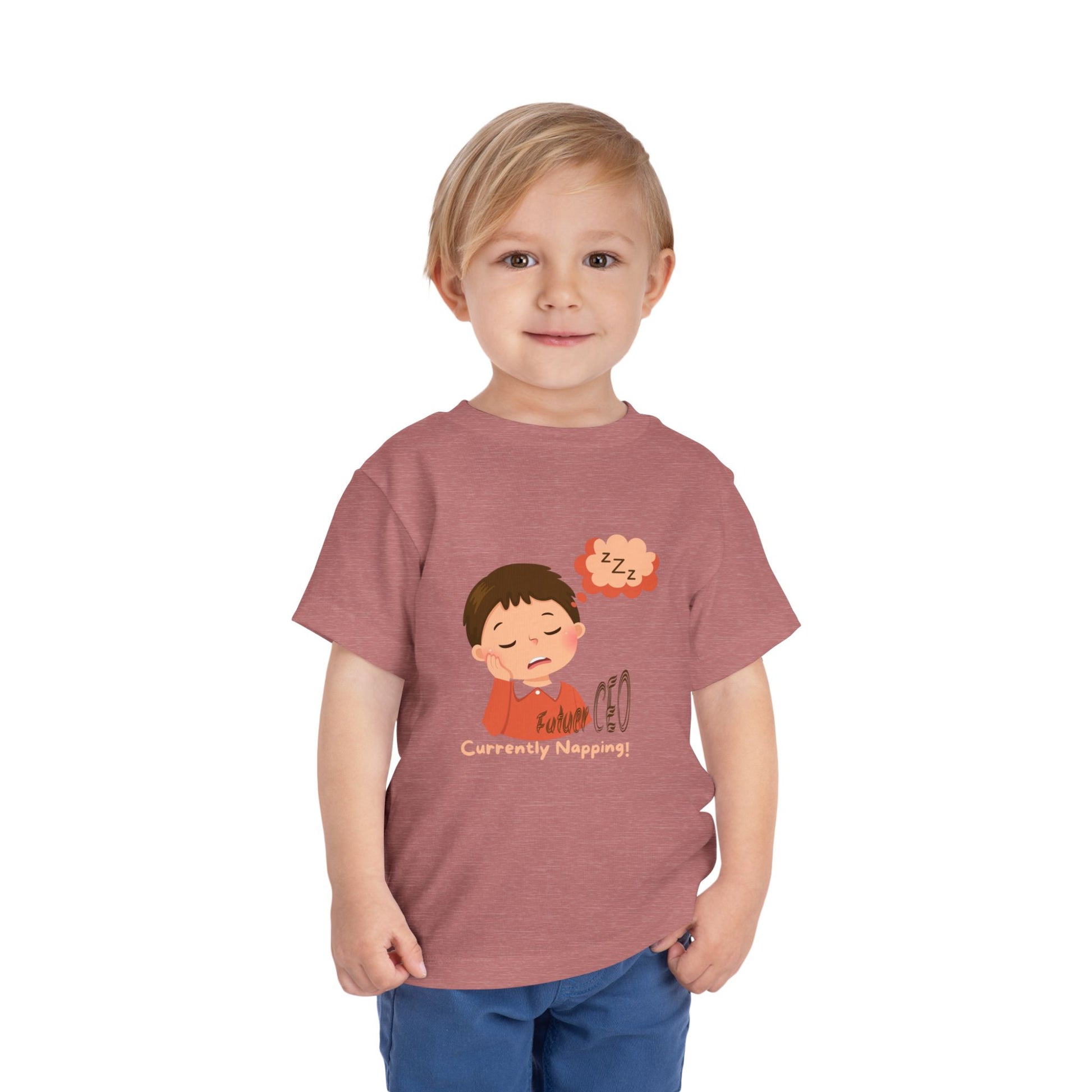 Child wearing a t-shirt with a cartoon design on a white background