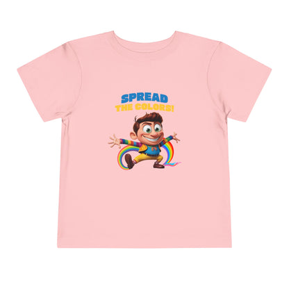 Cartoon boy jumping with rainbow trail and "Spread the Colors!" text on pink T-shirt.

