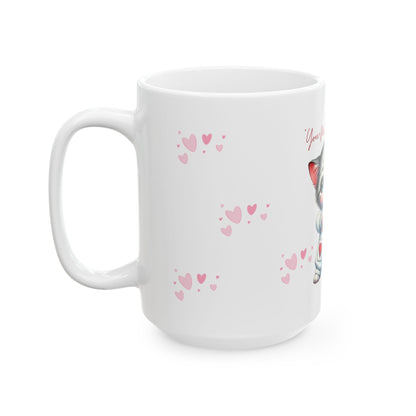 White mug with pink heart patterns on a white background