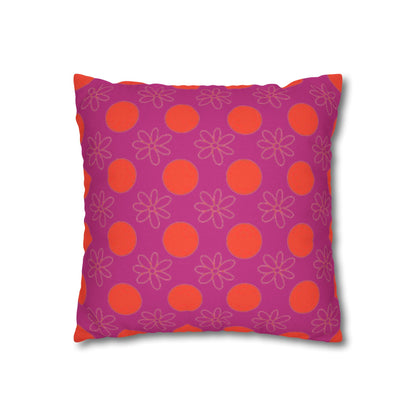 Decorative pillow with pink and orange pattern on a white background