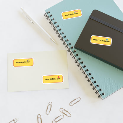 Notebooks with safety reminder stickers on a white surface