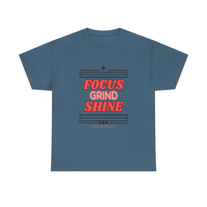 A indigo blue unisex heavy cotton tee with the text 'FOCUS GRIND SHINE' printed on the front.