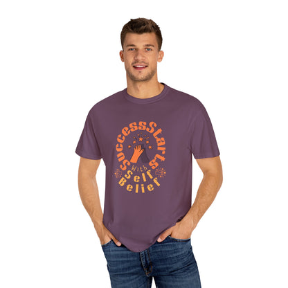 Man wearing a purple t-shirt with motivational text on a white background

