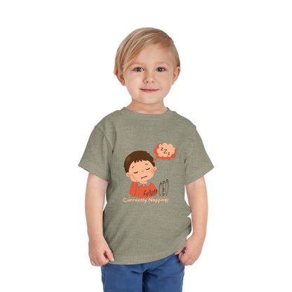 Child wearing a gray t-shirt with a cartoon design on a white background