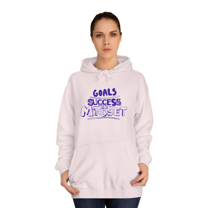 Person wearing a light pink hoodie with a motivational quote on a white background