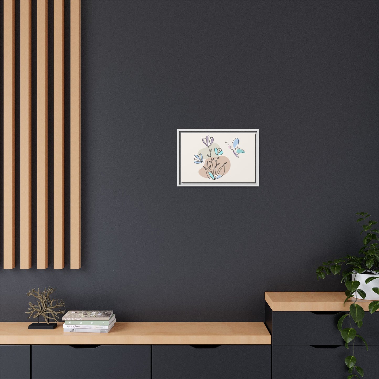 Framed artwork on a dark wall with wooden shelves and decor items.