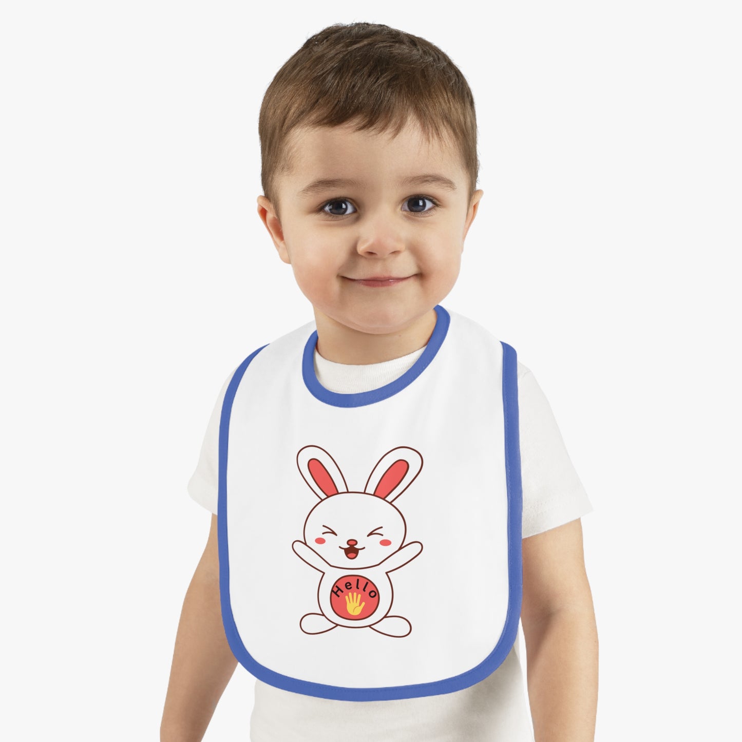 Child wearing a bib with a cartoon rabbit design on a plain background