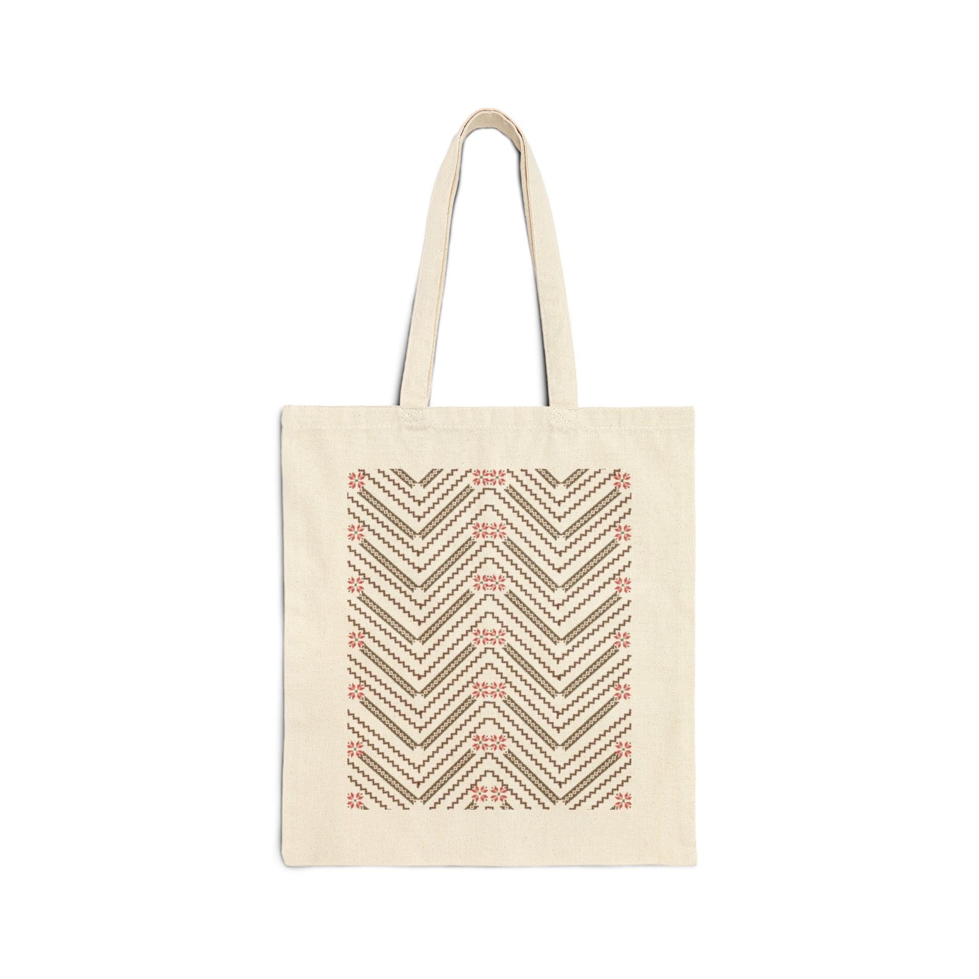 A beige cotton canvas tote bag with a geometric pattern in the center.