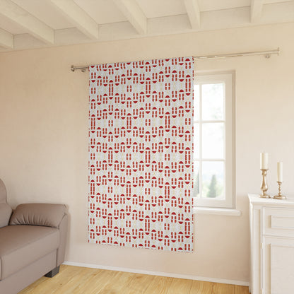 Red and white geometric pattern curtain hanging on window in a modern room

