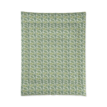 A comforter with a geometric pattern in shades of green and white, displayed against a white background.