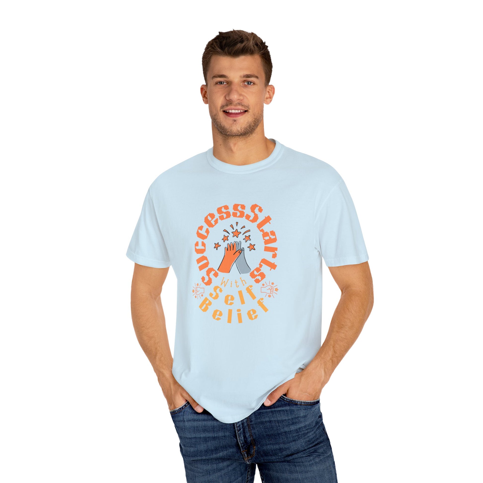 Man wearing a light blue t-shirt with a graphic design on a white background

